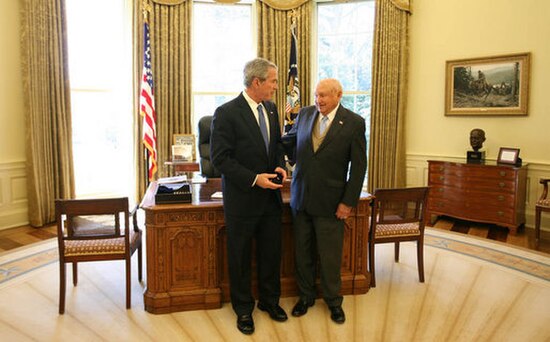 President George W. Bush stands with Truett Cathy after he received the Lifetime President's Volunteer Service Award at the White House