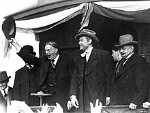 Teddy Roosevelt (Thomas A. Curran) campaigns with Kane in the News on the March sequence. Citizen-Kane-Whistle-Stop.jpg