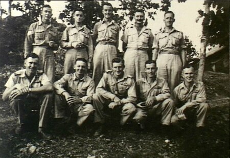 McCool with fellow members of the No. 33 Squadron at Laloki River, New Guinea circa 1943. McCool is in the front row, centre.