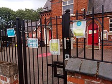 Signs related to the COVID-19 pandemic at a primary school in Seagrave. Covid at Seagrave Village Primary School.jpg