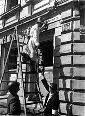 Adolf Hitler street sign being taken down in Trier during denazification Denazification-street.jpg