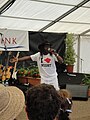 Derek Sandy, a singer originally from Trinidad and Tobago but now living on the Isle of Wight, performing at the Old Gaffers Festival 2011, Yarmouth, Isle of Wight. He is popular locally for the song "Welcome to the Isle of Wight", which he was performing in the photo.