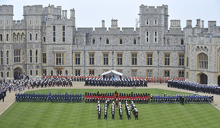 Sailors of the Royal Navy and marines of the Royal Marines, pass in review in front of Queen Elizabeth II as troops from all three services form on parade during the Diamond Jubilee Parade and Muster. Diamond Jubilee Parade and Muster Royal Navy and Royal Marines pass in review.jpg