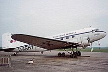 A Douglas DC-3 painted in Ruskin Air Services fictional markings during filming at Duxford Airfield in 1982 for the British television series Airline. Douglas C-47A G-DAKS G-AGHY Ruskin AS DUX 250482R edited-2.jpg