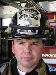 An American firefighter with a lieutenant's helmet FF Helmet.JPG