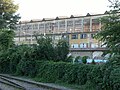 Fence, vegetation, factory, Brno.JPG