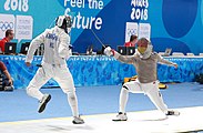 Deutsch: Fechten bei den Olympischen Jugend-Sommerspielen 2018: Tag 1, 7. Oktober 2018, Jungen, Säbel, Runde der letzten 16 - Ali Al-Bahrani (KSA) Vs Antonio Heathcock (GER) 9:15 English: Fencing at the 2018 Summer Youth Olympics at 7 October 2018 – Boys' sabre Round of 16 – Ali Al-Bahrani (KSA) Vs Antonio Heathcock (GER) 9:15