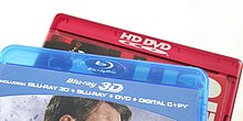 Although HD DVD and Blu-ray used near-identical translucent keep cases for most pre-recorded releases, they were normally coloured red for the former and blue for the latter. HD-DVD and Blu-Ray cases (crop).jpg