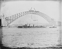 Passing the Sydney Harbour Bridge, 3 October 1930, named De Ruyter at the time. HNLMS DE RUYTER near the Sydney Harbour Bridge, 3 October 1930.jpg