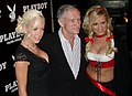 Celebrating his 80th birthday with Kendra Wilkinson and Bridget Marquardt in Munich, April 2006.