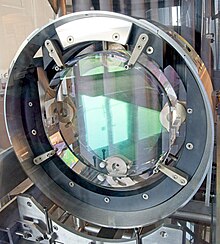 One of the mirrors from the initial Virgo detector, now used as an exposition model at the Virgo site. Initial Virgo mirror.jpg