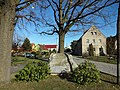 Memorial to the fallen of the First World War and a stone facing the road