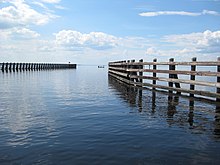 Wooden pilings mark the navigable channel for vessels entering Lake George from the St. Johns River in Florida. Lake George Channel.jpg