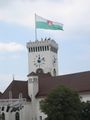 Ljubljana Castle tower with flag of Ljubljana
