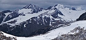 Luahna Peak from High Pass. True summit and Pilz Glacier on left; Luahna's northwest summit (aka "Chalangin Peak") and Butterfly Glacier on right Luahna Peak from High Pass.jpg