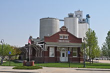 Marion Library, in former Santa Fe depot (Marion CO-OP grain elevator in background) (2011) MarionLibrary.jpg