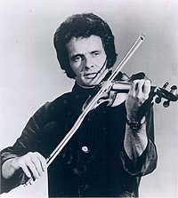 Merle Haggard and others influenced the sound of artists such as Bob Dylan, Ian and Sylvia, and the Byrds who adopted the sound of country music in the late 1960s. Merle Haggard 1975 - cropped.jpg