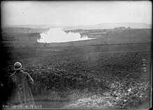 Explosion of a mine, as seen from a French position in 1916 Mine-explosion-1916.jpg