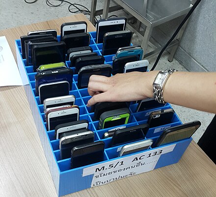In some schools, a mobile phone cage is used to prevent students from using smartphones in the classroom during lessons.