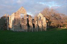 Facade of the reredorter (communal latrine), with the windows of the Tudor long gallery on the left Netrered.jpg