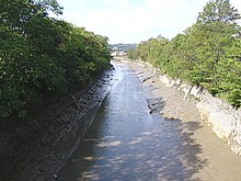 The New Cut at low tide, seen from Gaol Ferry Bridge New Cut 02.jpg