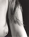 Nude female showing a nipple.jpg