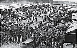 Officers of No 1 Squadron, RAF with SE5a biplanes at Clairmarais aerodrome, near Ypres, July 1918.jpg