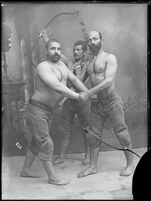 Studio Portrait of Three Persian Wrestlers by Antoin Sevruguin, c. 1890. Persian Wrestlers, taken by Anton Sevruguin.jpg