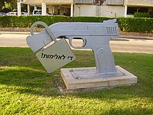 A sculpture in Petah Tikva, Israel of a padlock on the warped barrel of a semi-automatic pistol, with the inscription "stop violence!" in (Hebrew: !dy lAlymvt
) PikiWiki Israel 20285 quot;Stop Violencequot; sculpture in Petah Tikva.JPG