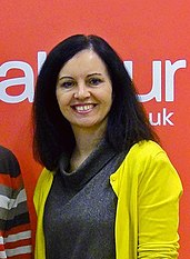 Flint in 2012 Redhill Holy Trinity Church Hall - Mar 2012 - Caroline Flint MP with Rhys.jpg