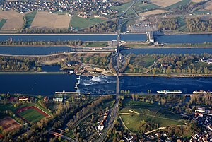 In the foreground the Rhine, in the background the Rhine canal with the lock and the Vogelgrun power station.