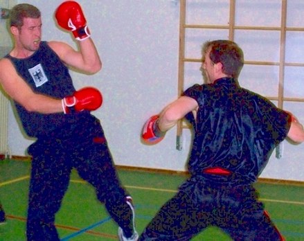 Two Dutch fighters in a sparring session of Sanshou.