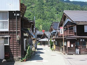 Street with two-storied wooden houses.