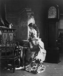 "Sarony's Centennial Tableaux", showing young woman making U.S. Flag on sewing machine, c1876