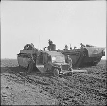 A Buffalo of 4th Royal Tank Regiment unloads a jeep during the crossing of the Rhine, 24 March 1945 The British Army in North-west Europe 1944-45 BU2058.jpg