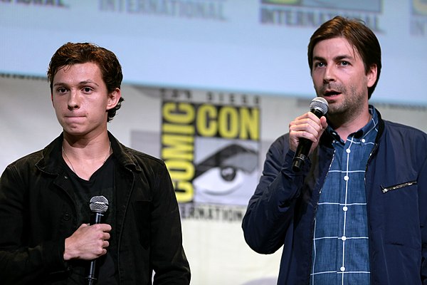 Actor Tom Holland (L) and director Jon Watts (R) were signed to return for the sequel early in development.