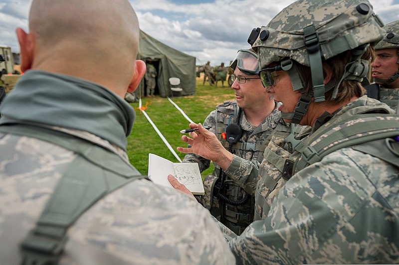 File:U.S. Air Force Lt. Col. Bonnie Stiffler, front right, a clinical nurse with the 81st Medical Group, Keesler Air Force Base, Miss., describes a tent layout plan with observer-controller-trainers during Joint 140314-F-XL333-176.jpg