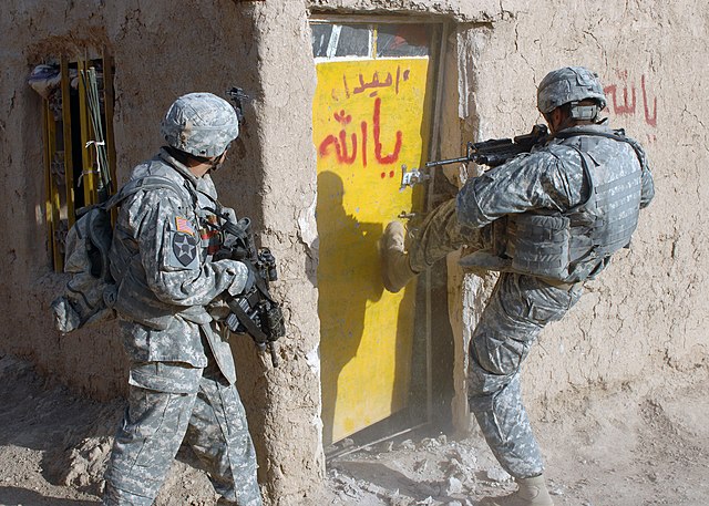 640px-US_Navy_071223-N-1132M-050_Soldiers_attached_to_2nd_Squadron,_1st_Cavalry_Regiment_breach_a_door_during_a_clearing_mission.jpg