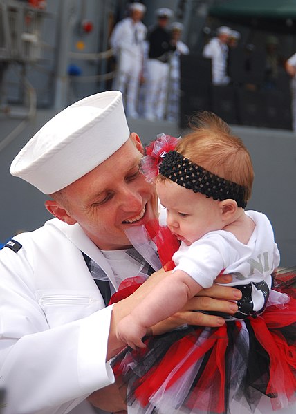 File:US Navy 110506-N-9985W-043 Engineman 2nd Class James Canipe hugs his baby daughter during the homecoming of USS Lake Champlain (CG 57) at Naval Bas.jpg