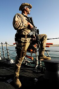 US Navy 120129-N-WD757-354 Chief Cryptologic Technician (Technical) Michael Perry stands watch as the Arleigh Burke-class guided-missile destroyer .jpg