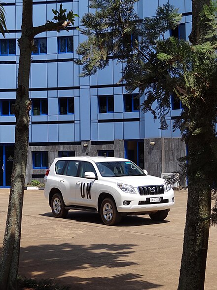 United Nations vehicle outside the distinctive front of the "Blue Whale" - the Imperial Beach Hotel.