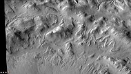 Enlargement of northern wall of Lipik, as seen by CTX camera (on Mars Reconnaissance Orbiter). Many tongue-shaped glaciers are visible. Note: this is an enlargement of the previous image.