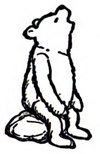 Winnie-the-Pooh sitting on a rock, looking up