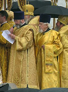 Protodeacon Vladimir Nazarkin (left) and archdeacon Andrei Mazur of the Russian Orthodox Church during procession. Protodiakon Vladimir Nazarkin i arkhidiakon Andrei Mazur.jpg