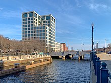 121 South Main Street, home to the Brown University School of Public Health. Proximity to the medical campus fosters collaboration between faculty and students of Alpert Medical School and the School of Public Health. 121 South Main St and Providence River.jpg