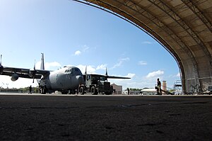 156th Airlift Wing C-130 Hercules being pushed into a hangar at Muñiz Air National Guard Base.jpg
