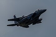 An F-15E Strike Eagle, tail number 01-2003, taking off from RAF Lakenheath in England. The aircraft is assigned to the 494th Fighter Squadron.