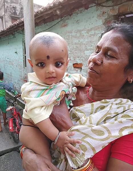 File:A grand mother with a baby.jpg