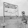 A malaria warning sign on the Anzio front in Italy, advising troops to cover up in the evening to avoid mosquito bites, 10 May 1944. NA14700.jpg