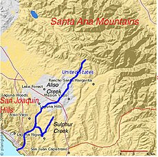 Mountains are to the upper right (northeast) and lower left (southwest), and the flat land in between is highly urbanized.